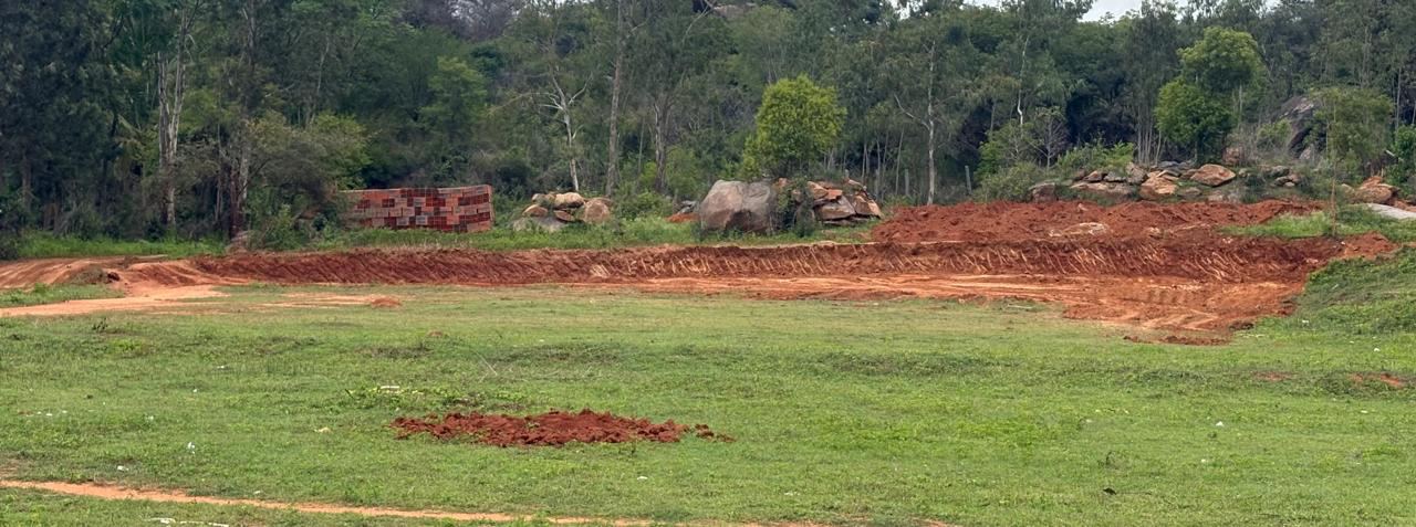 The hostel block site, levelled and marked out — the field beside it will be the playing ground
